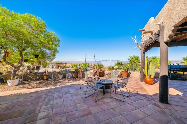 4390 El Camino Rd, Bullhead City, AZ 86429 - view of patio featuring a fire pit