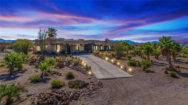 4390 El Camino Rd, Bullhead City, AZ 86429 - pueblo-style home featuring stucco siding