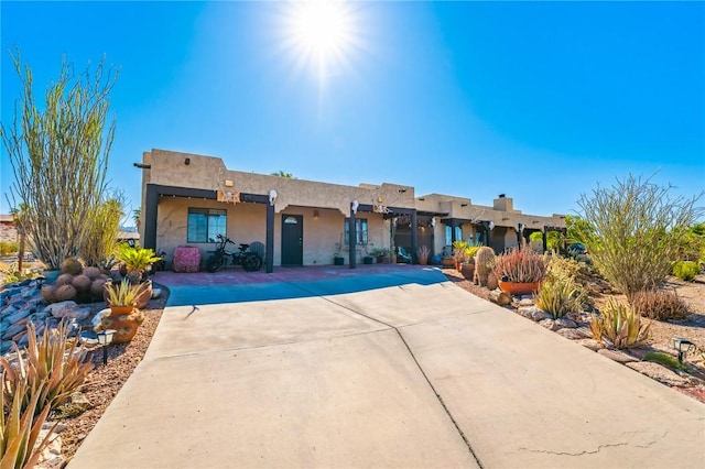 4390 El Camino Rd, Bullhead City, AZ 86429 - pueblo-style house featuring stucco siding