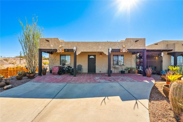 4390 El Camino Rd, Bullhead City, AZ 86429 - rear view of property with a patio and stucco siding