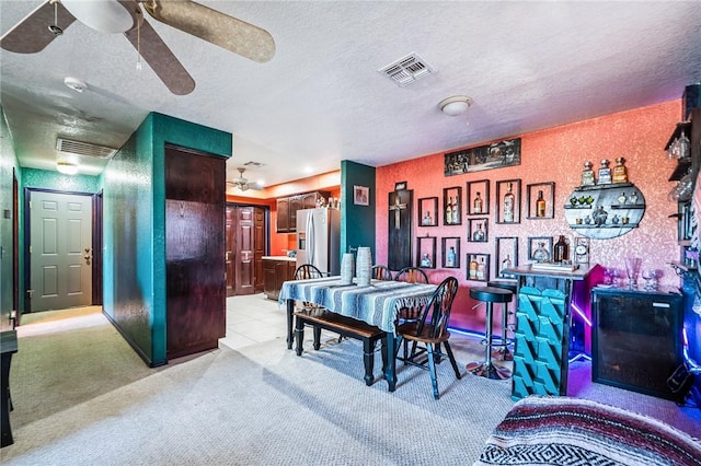 4390 El Camino Rd, Bullhead City, AZ 86429 - dining room with a ceiling fan, a textured ceiling, and light colored carpet