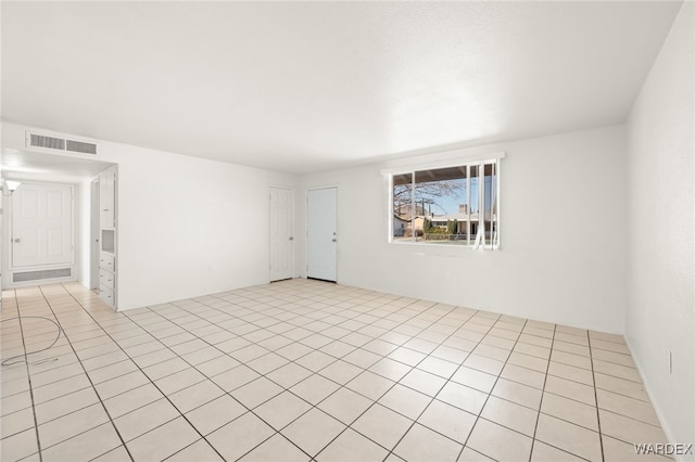 spare room with light tile patterned floors and visible vents