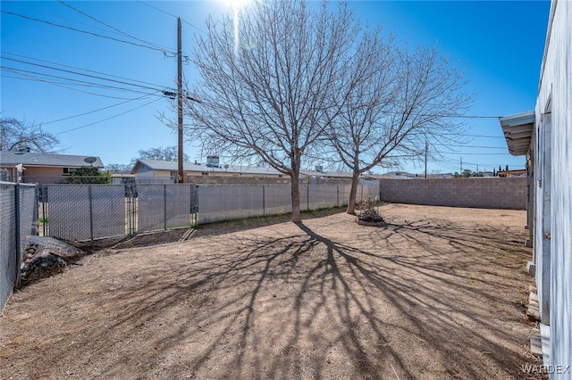 view of yard with a fenced backyard