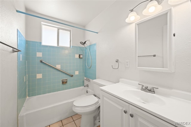 bathroom with  shower combination, tile patterned flooring, toilet, and vanity