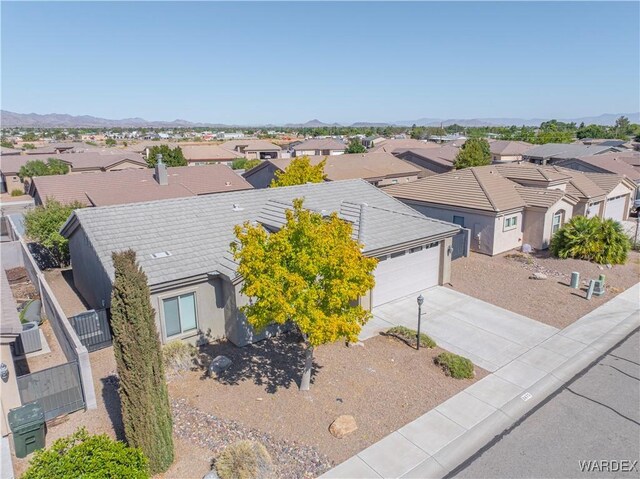 drone / aerial view with a residential view and a mountain view