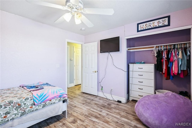 4403 S Via Rialto Ln, Fort Mohave, AZ 86426 - bedroom featuring baseboards, a ceiling fan, a closet, and wood finished floors