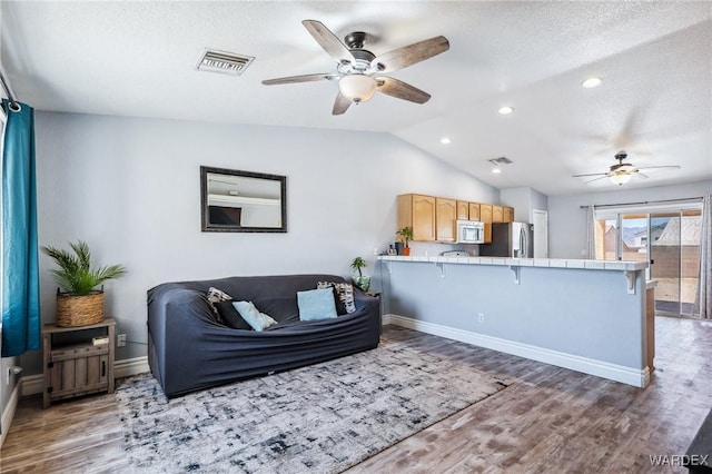 4403 S Via Rialto Ln, Fort Mohave, AZ 86426 - living area featuring a ceiling fan, baseboards, wood finished floors, and lofted ceiling