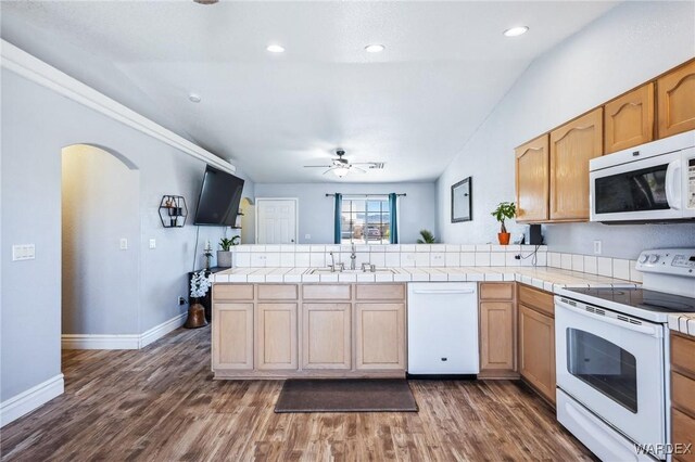 4403 S Via Rialto Ln, Fort Mohave, AZ 86426 - kitchen with a peninsula, white appliances, ceiling fan, dark wood-type flooring, and a sink