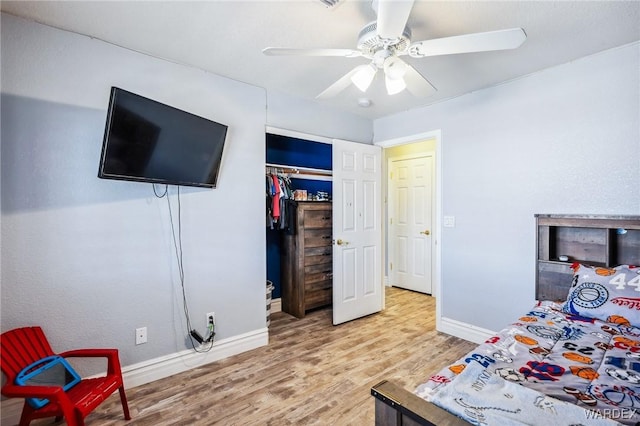 4403 S Via Rialto Ln, Fort Mohave, AZ 86426 - bedroom with a closet, baseboards, a ceiling fan, and wood finished floors