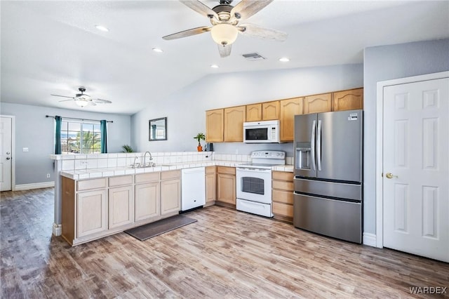 4403 S Via Rialto Ln, Fort Mohave, AZ 86426 - kitchen with a ceiling fan, visible vents, a sink, lofted ceiling, and white appliances
