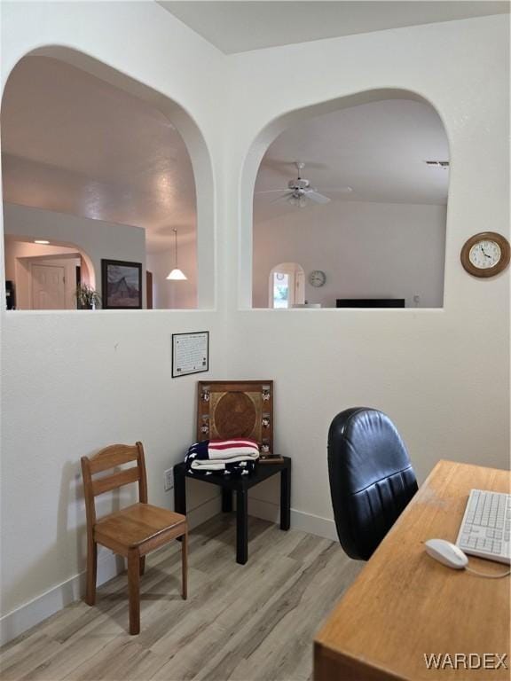 home office with ceiling fan and wood finished floors