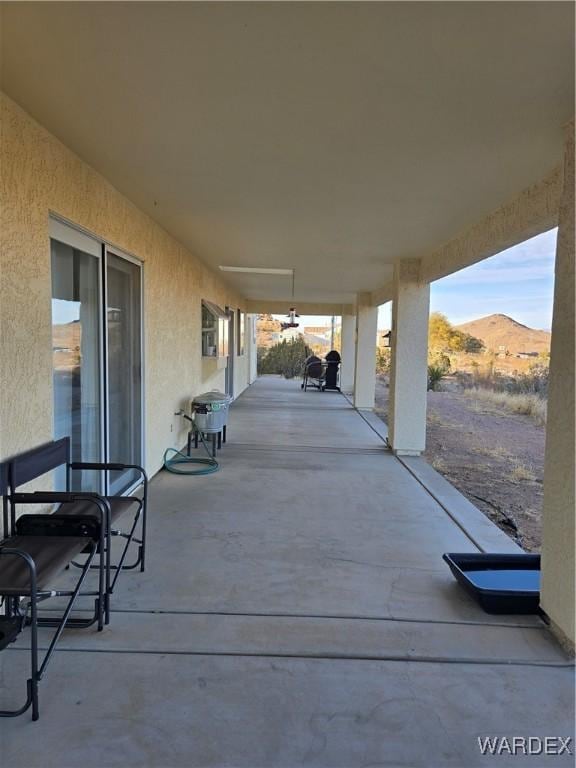 view of patio / terrace with a mountain view