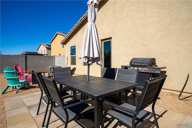 view of patio / terrace featuring outdoor dining area and fence