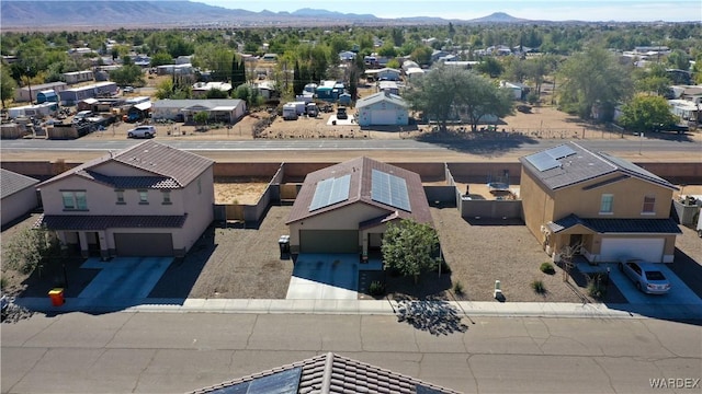 birds eye view of property with a residential view and a mountain view