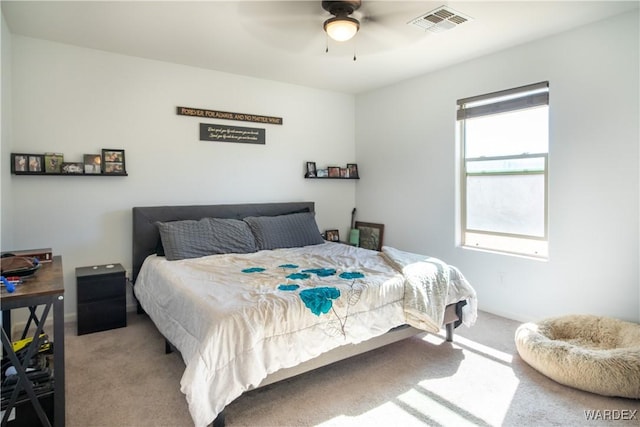 bedroom featuring carpet, visible vents, and ceiling fan