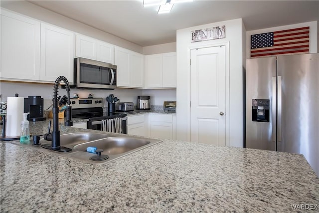 kitchen with white cabinets and stainless steel appliances