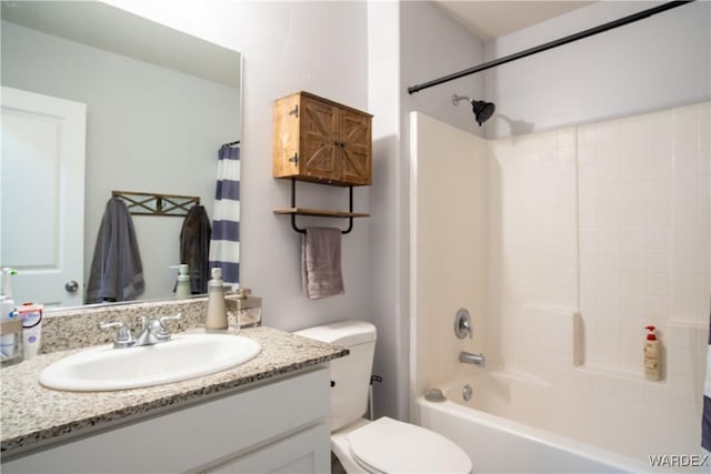 full bathroom featuring shower / bath combination with curtain, vanity, and toilet