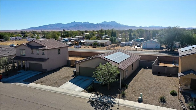 birds eye view of property with a residential view and a mountain view