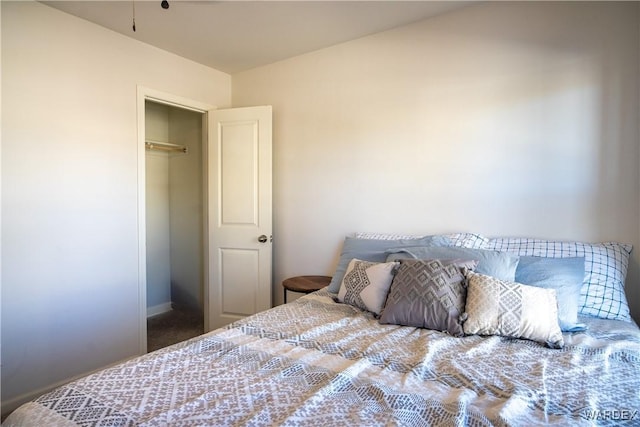 bedroom featuring baseboards and carpet flooring