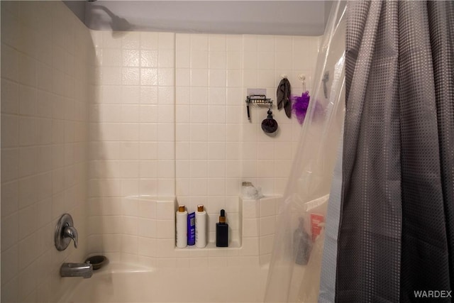 full bathroom featuring shower / bathtub combination with curtain