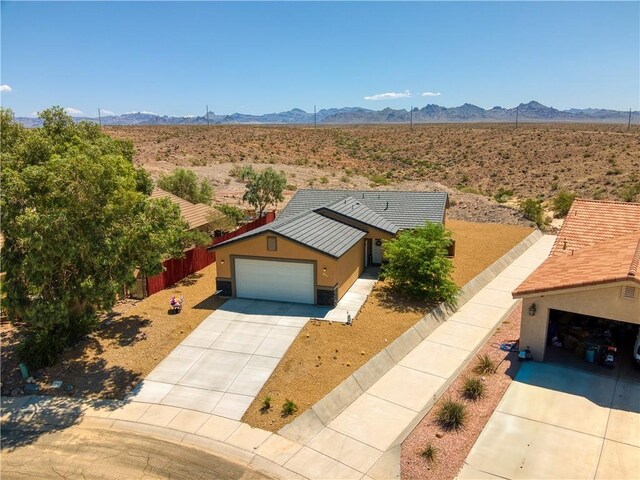3492 Tres Alamos Dr, Bullhead City, AZ 86442 - aerial view of sparsely populated area with a mountain backdrop and a desert landscape