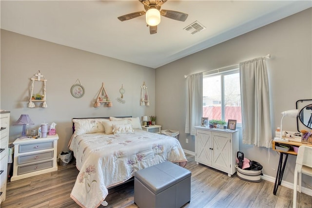 3492 Tres Alamos Dr, Bullhead City, AZ 86442 - bedroom with wood finished floors and a ceiling fan