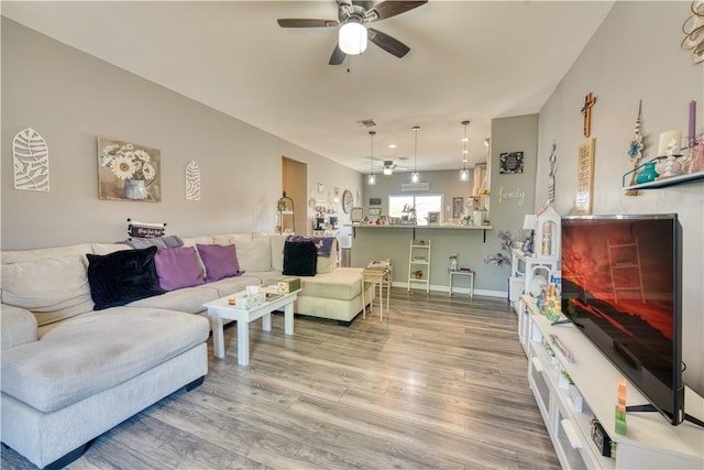 3492 Tres Alamos Dr, Bullhead City, AZ 86442 - living area with wood finished floors and a ceiling fan