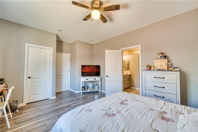 3492 Tres Alamos Dr, Bullhead City, AZ 86442 - bedroom with wood finished floors, a ceiling fan, lofted ceiling, and ensuite bath