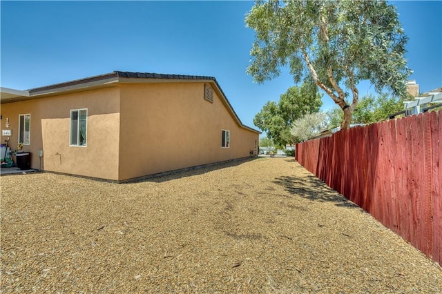 3492 Tres Alamos Dr, Bullhead City, AZ 86442 - view of side of home featuring stucco siding