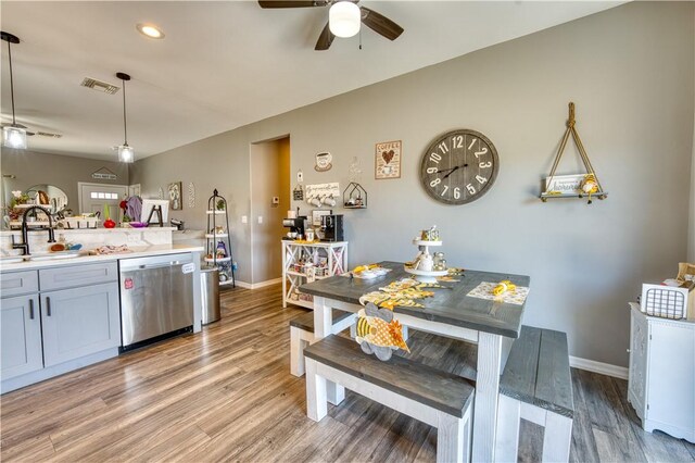 3492 Tres Alamos Dr, Bullhead City, AZ 86442 - kitchen featuring stainless steel dishwasher, ceiling fan, light wood-style flooring, light countertops, and recessed lighting