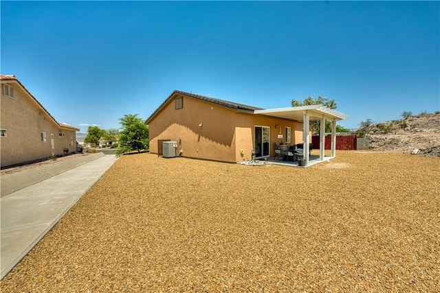 3492 Tres Alamos Dr, Bullhead City, AZ 86442 - back of house with a patio area and stucco siding