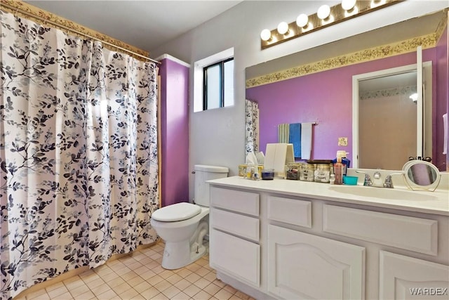 bathroom with toilet, a shower with curtain, tile patterned flooring, and vanity