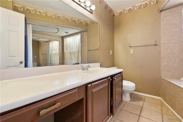 full bath with toilet, baseboards, vanity, and tile patterned floors