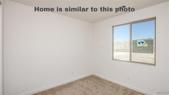 empty room with baseboards and carpet floors