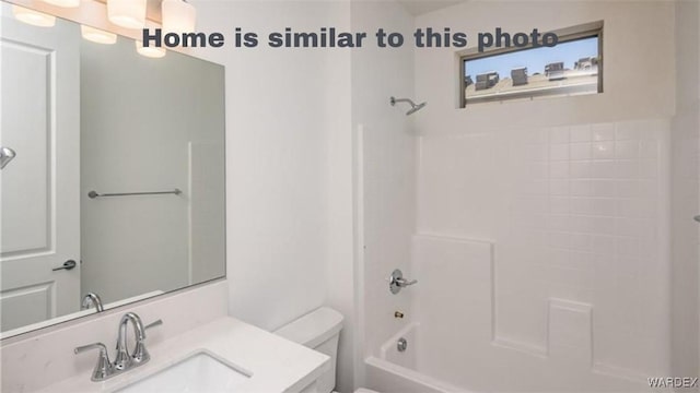 full bath featuring tub / shower combination, toilet, and vanity