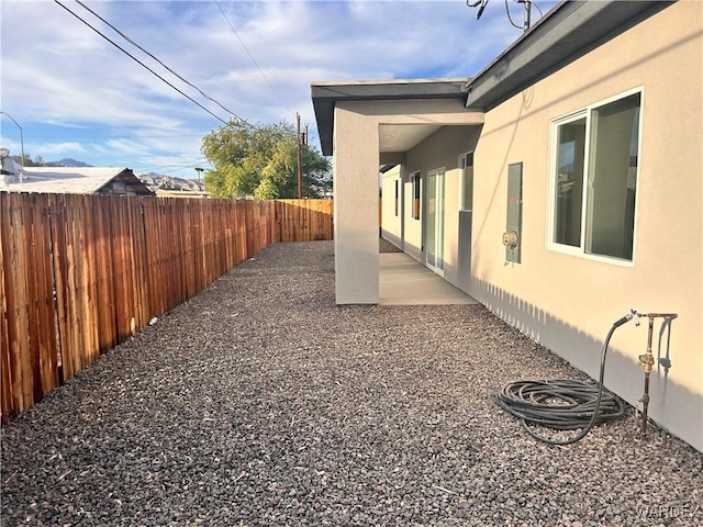 view of yard with a fenced backyard and a patio