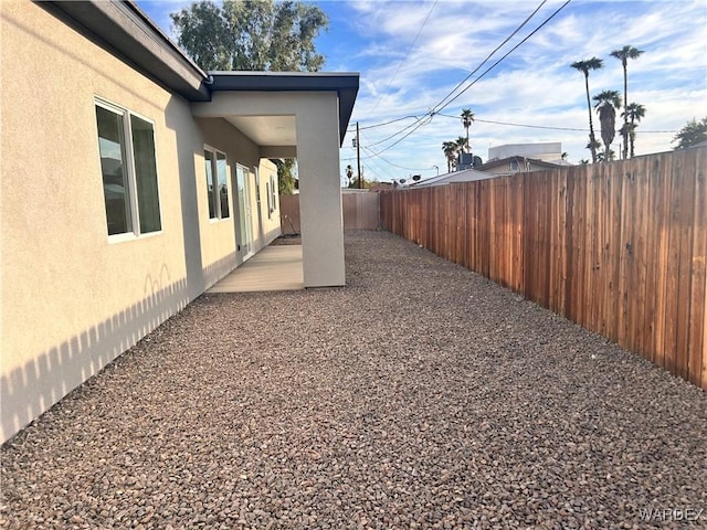 view of yard featuring a patio area and a fenced backyard