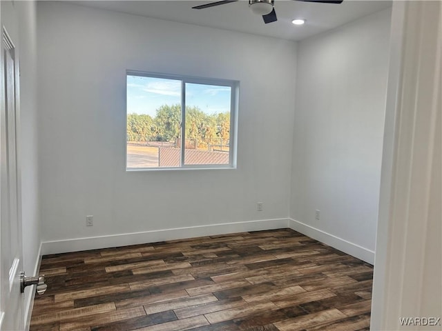 unfurnished room featuring recessed lighting, dark wood finished floors, a ceiling fan, and baseboards