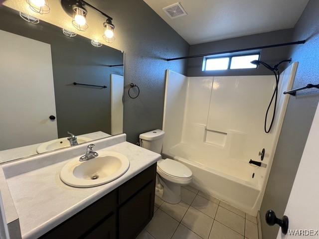 full bath featuring shower / tub combination, tile patterned flooring, toilet, visible vents, and vanity