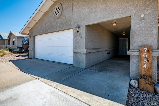 garage featuring driveway