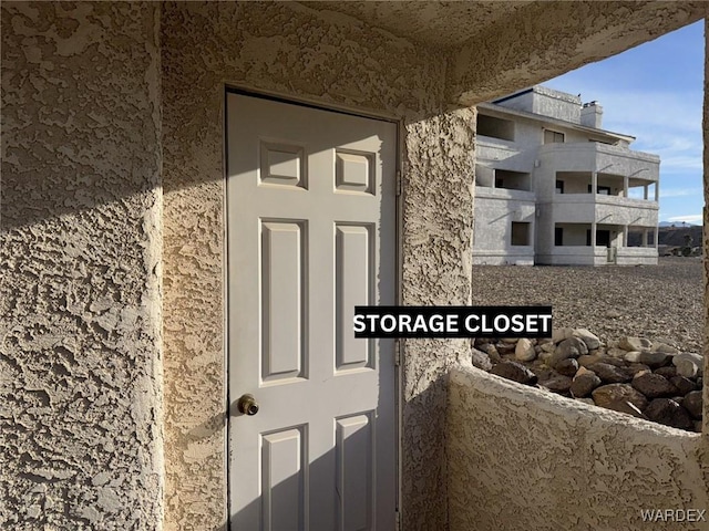 view of exterior entry with stucco siding