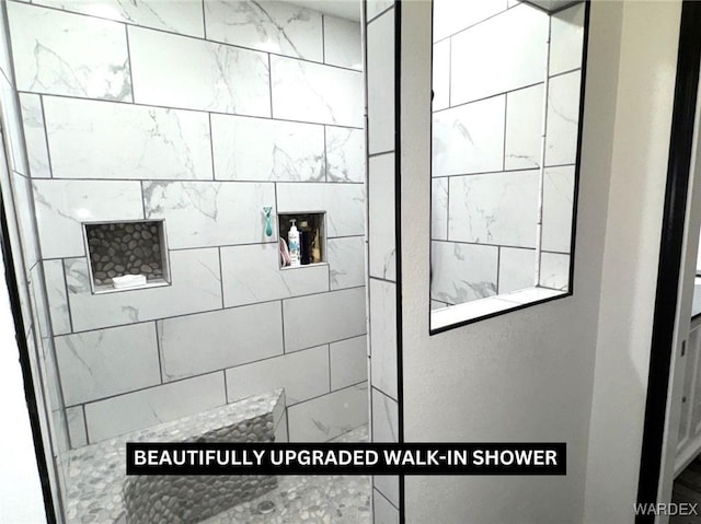 bathroom featuring a walk in shower