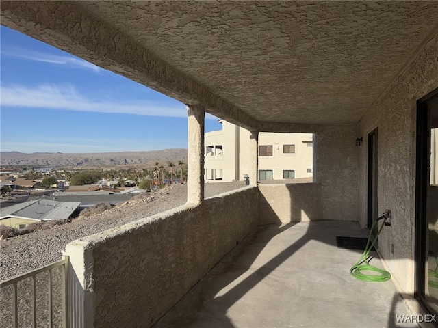 balcony featuring a mountain view