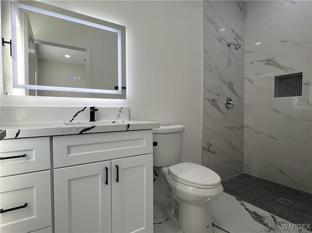 full bathroom with toilet, marble finish floor, a marble finish shower, and vanity