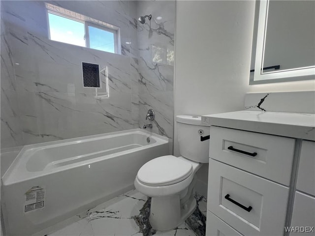 full bathroom featuring toilet, marble finish floor, tub / shower combination, and vanity