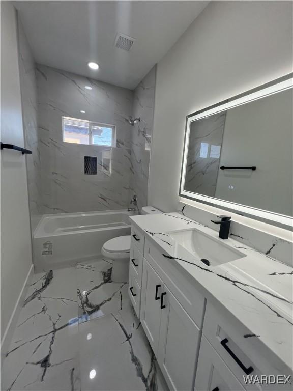 bathroom featuring toilet, visible vents, vanity, marble finish floor, and shower / bathing tub combination