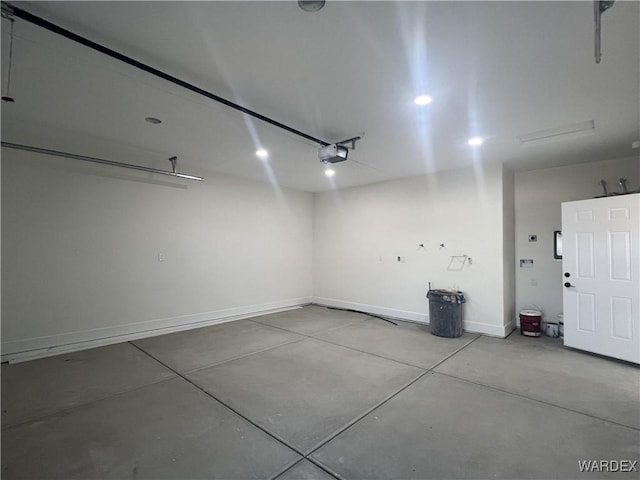 garage featuring baseboards and a garage door opener