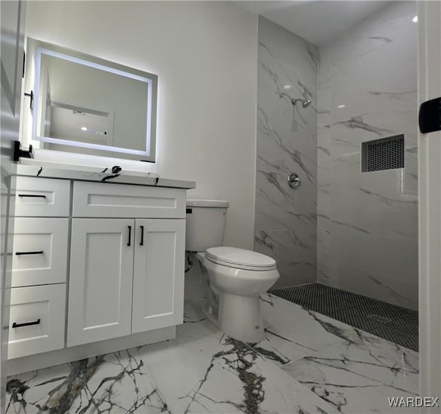 full bath with toilet, marble finish floor, a marble finish shower, and vanity