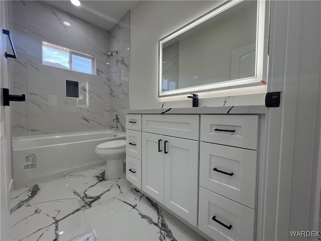 full bathroom with toilet, marble finish floor, shower / tub combination, and vanity