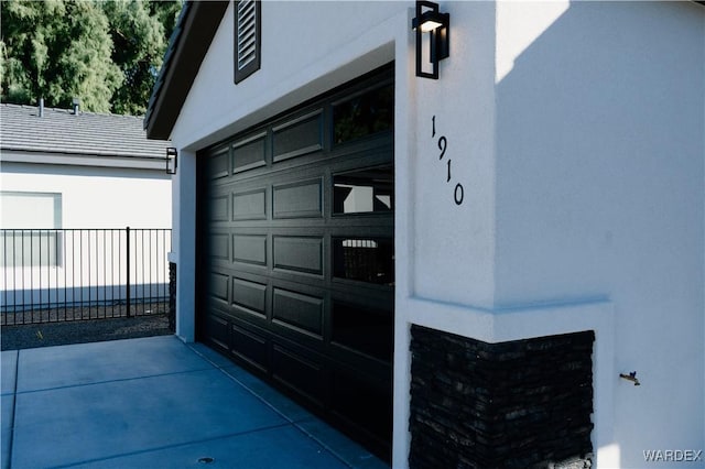 garage featuring fence